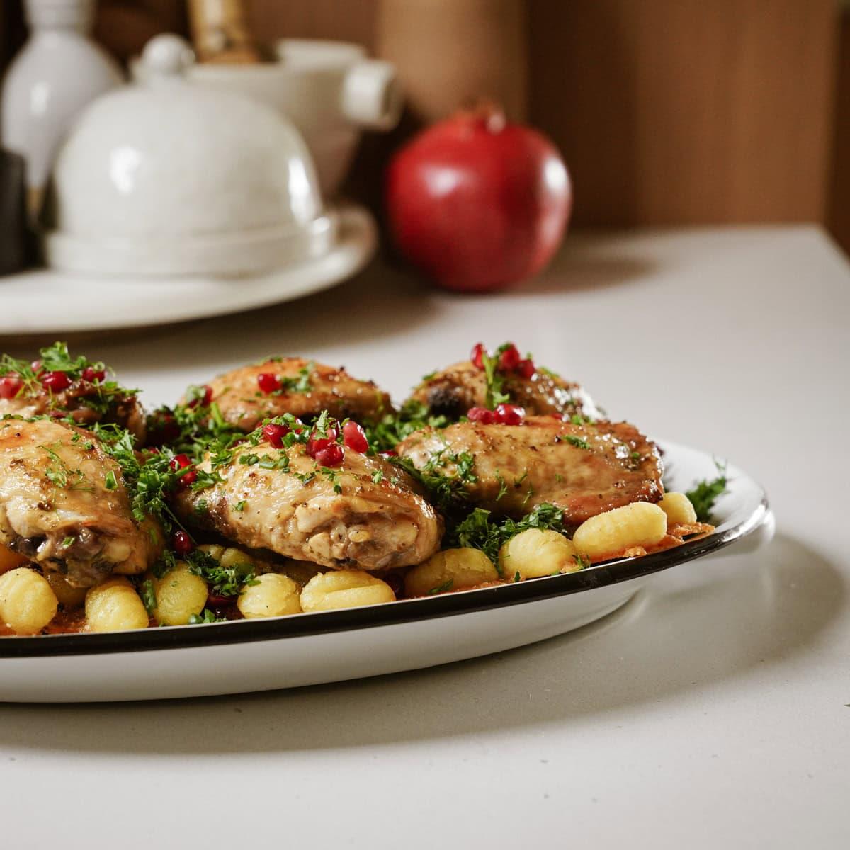 sheet pan chicken and gnocchi being served
