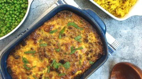 Close-up shot of the finished Bobotie, showing the texture and colour