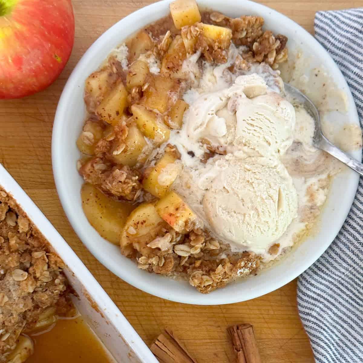 Close-up of the finished apple crisp, showing the golden-brown crust and bubbly apple filling