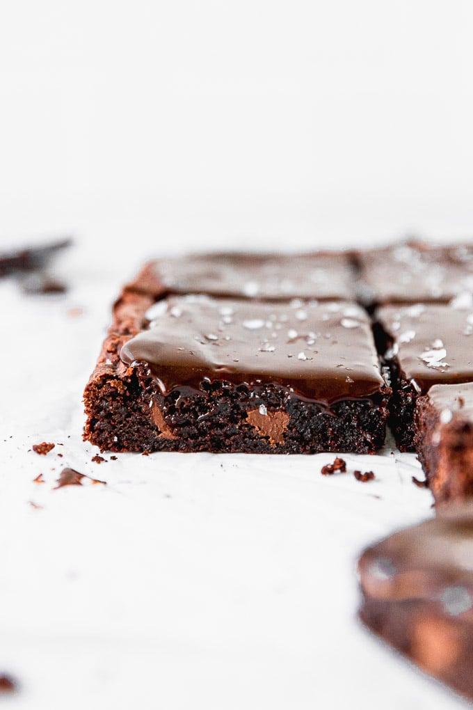 Gooey espresso brownies with rich chocolate ganache, close-up shot