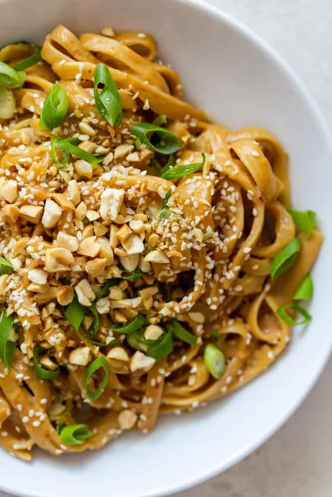 Close-up of the peanut sauce drizzled over the Thai peanut noodle grain bowl