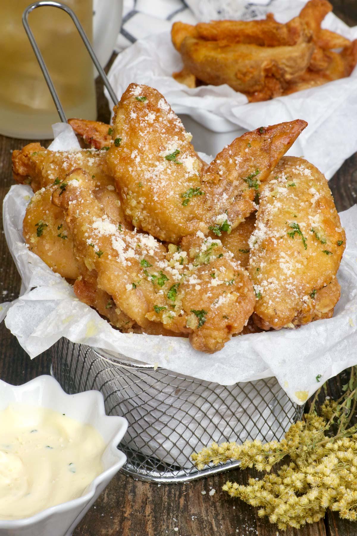 A group of friends enjoying garlic parmesan wings