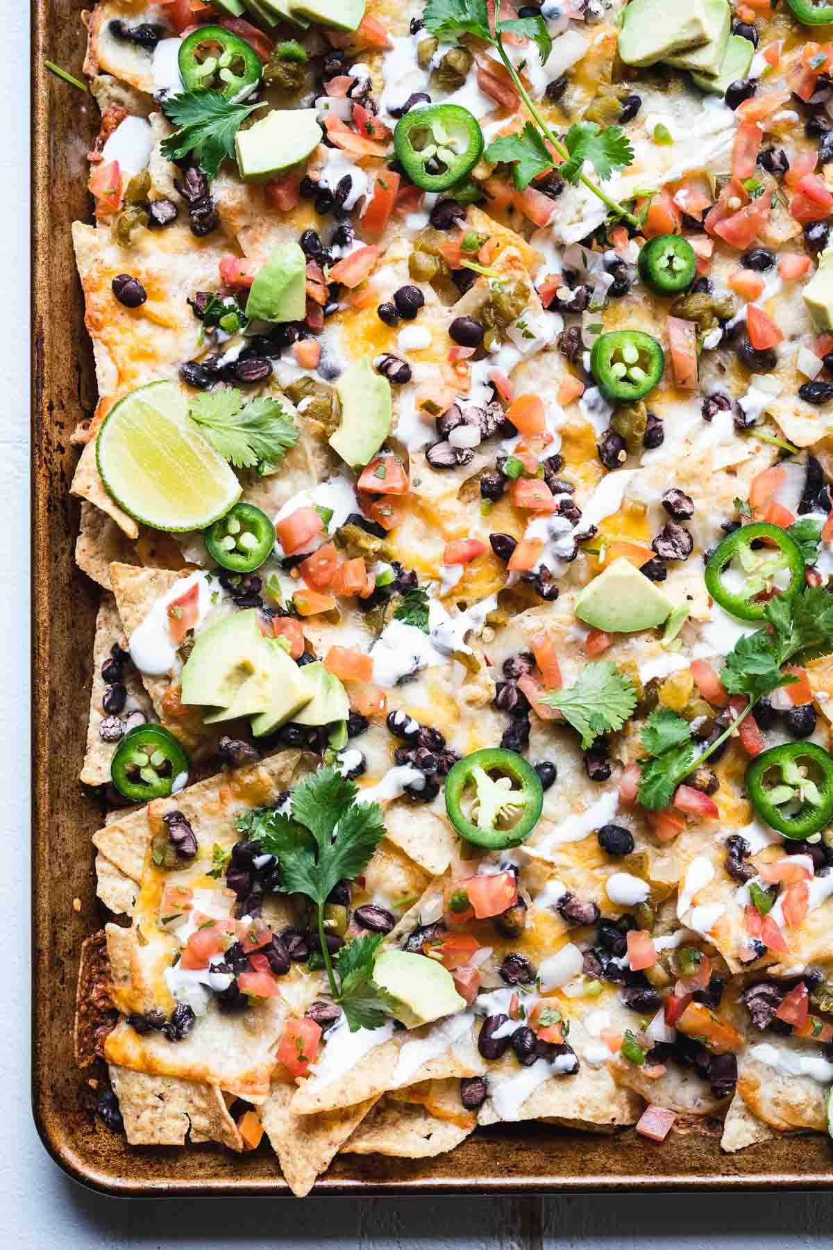 overhead shot of a platter of loaded pepper jack nachos