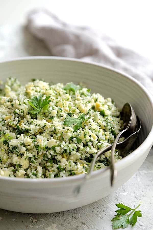 Close up shot of a person tasting the artichoke tabbouleh
