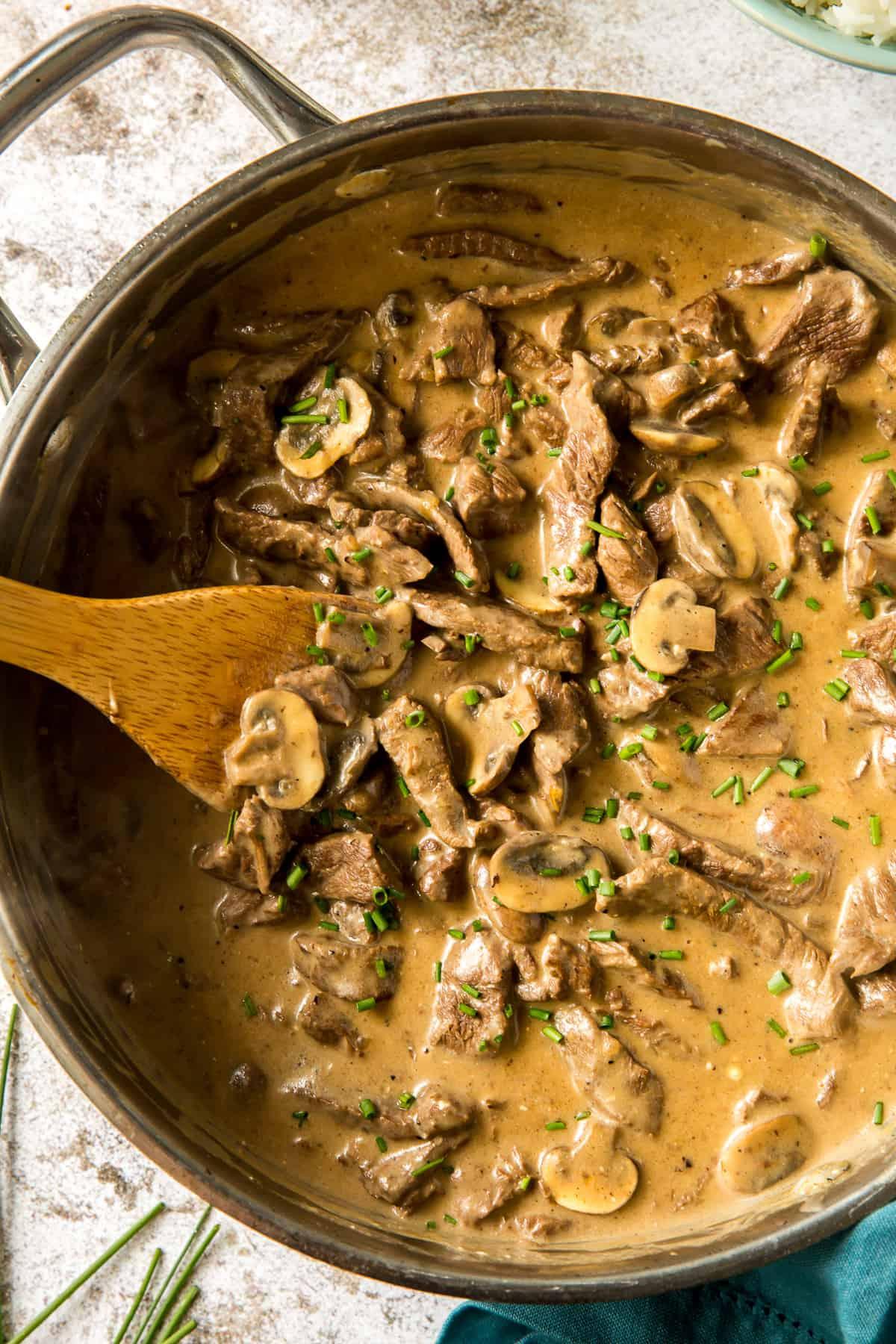 Beef stroganoff in a skillet, showing its rich and creamy sauce