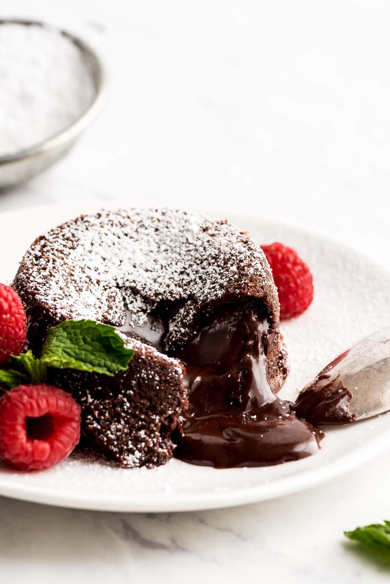 A perfectly gooey molten chocolate cake with a dusting of powdered sugar