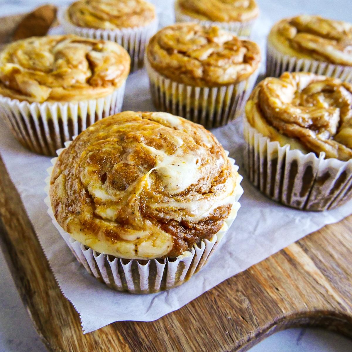 pumpkin cream cheese muffins with a cream cheese swirl
