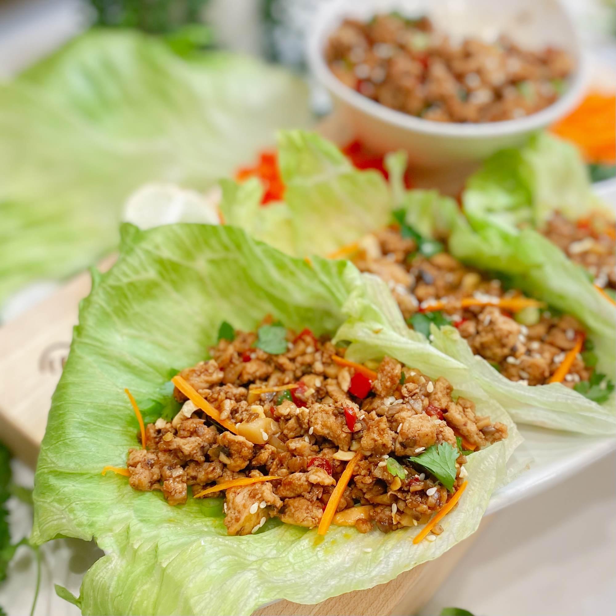 various ingredients for chicken lettuce wraps arranged on a counter