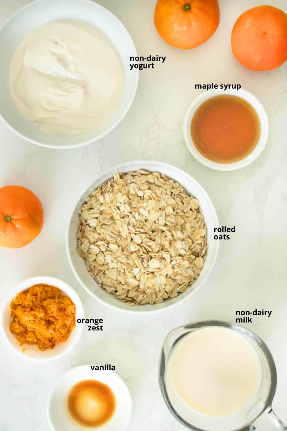 ingredients for tangerine overnight oats on a wooden table
