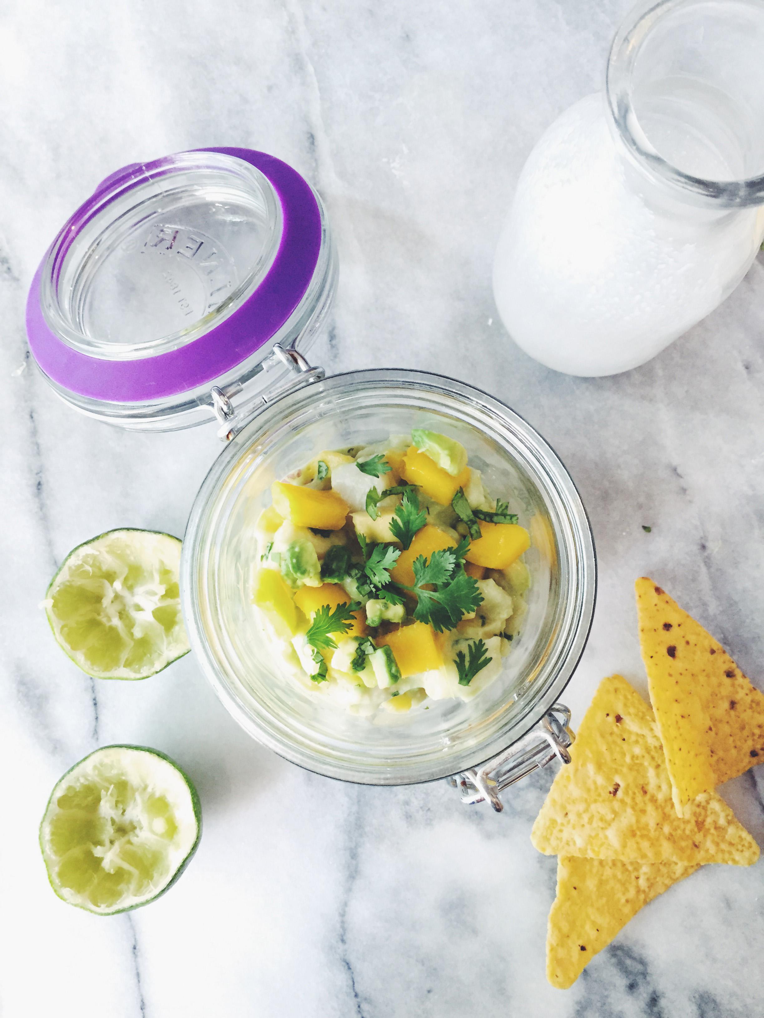 close-up shot of a spoonful of mango ceviche with coconut milk
