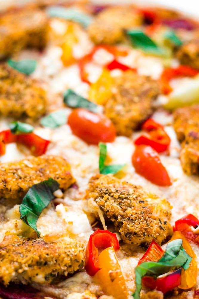 Mediterranean Curry Pizza with Halloumi, close-up shot showing the halloumi, curry sauce, and vegetables