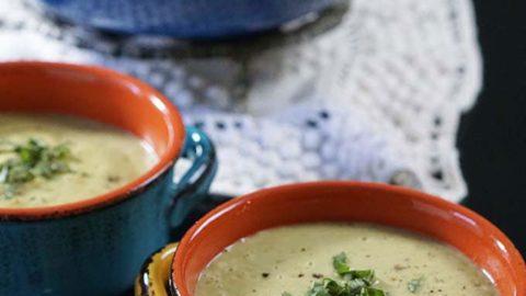 A person enjoying a bowl of garlic parmesan zucchini soup