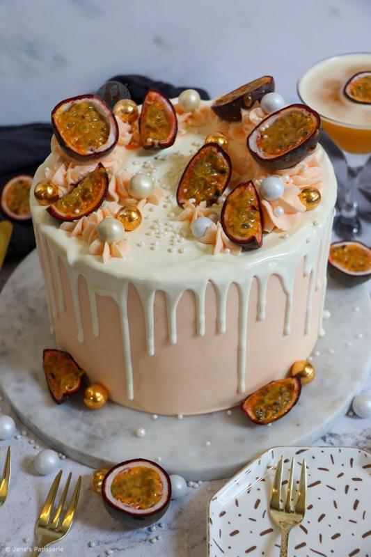 a vibrant passion fruit and cream birthday cake, decorated with passion fruit segments