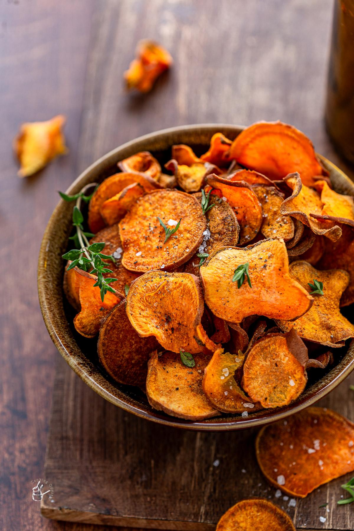 Baked sweet potato chips arranged on a plate