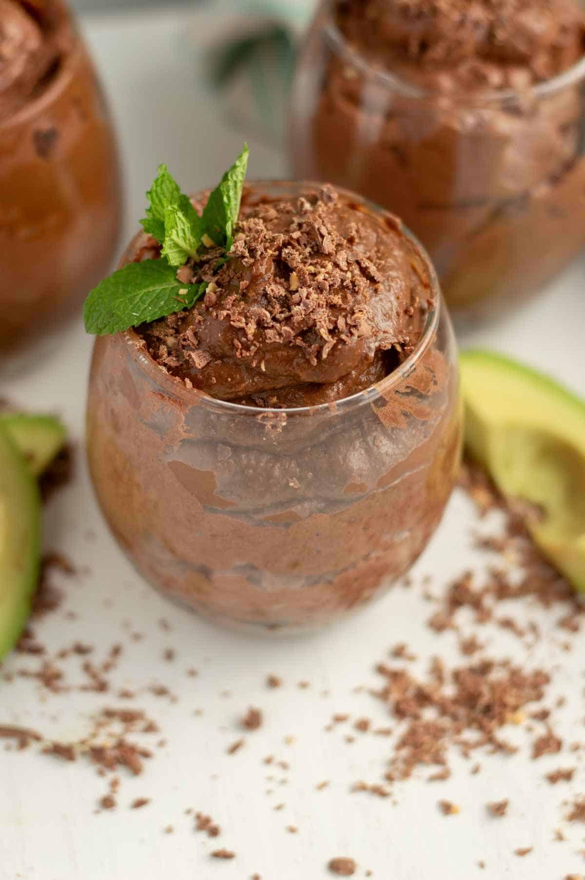 A person enjoying a glass of the avocado chocolate mousse