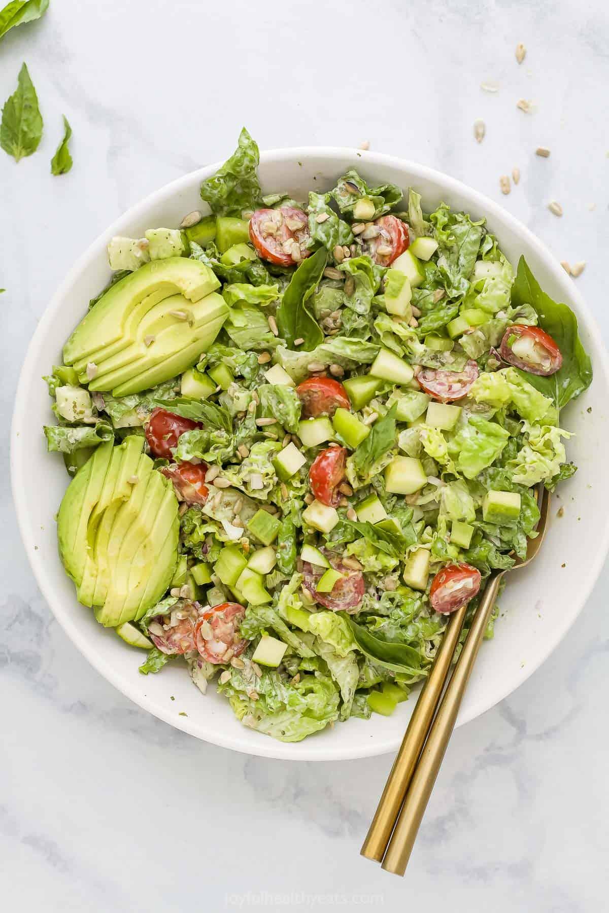 A full bowl of Strawberry Green Goddess Salad, showing texture and color