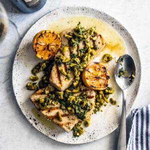 overhead shot of lemon and herb pasta with swordfish