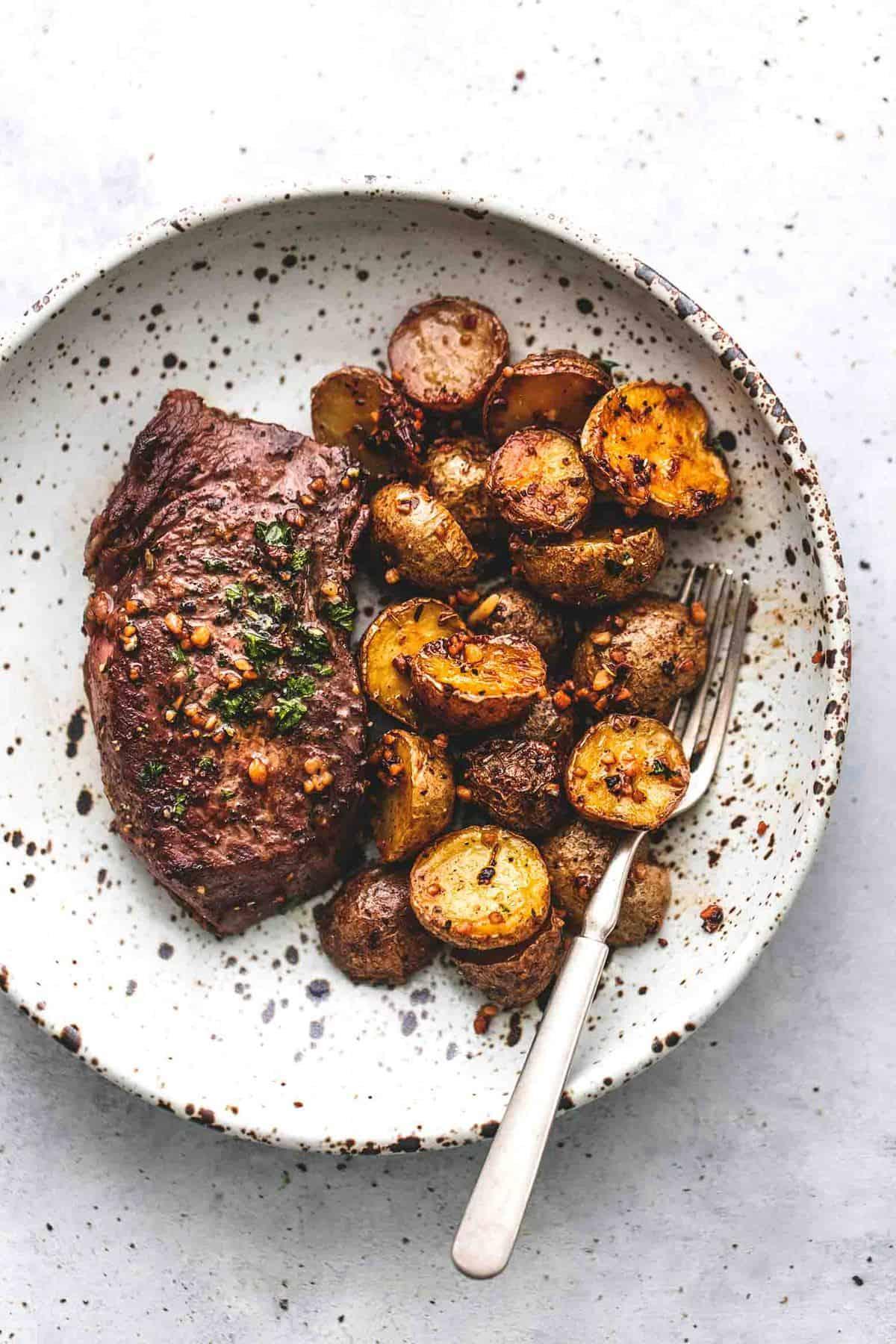 Steak and potatoes on a plate