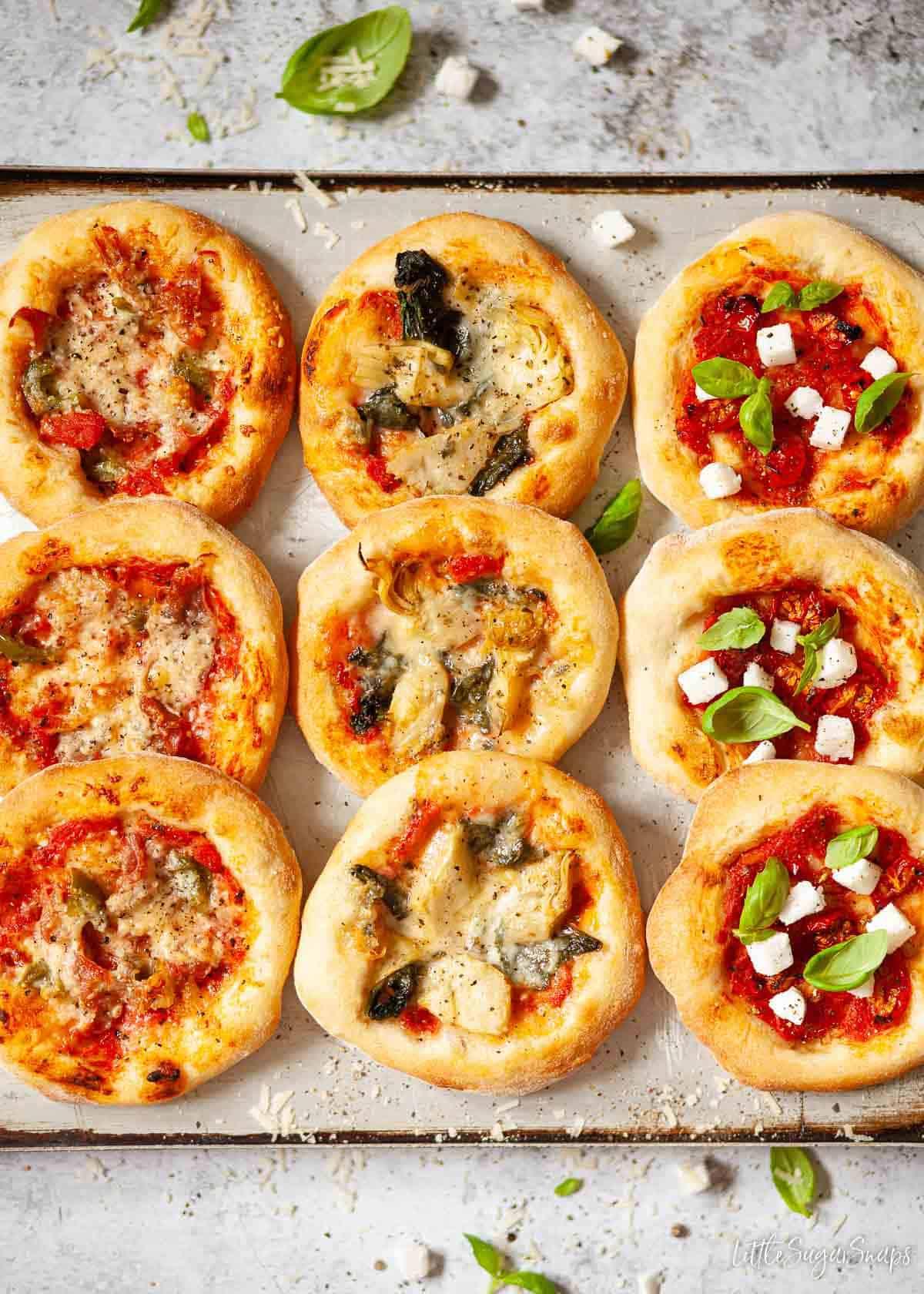 close up of a tray of mini pizzas