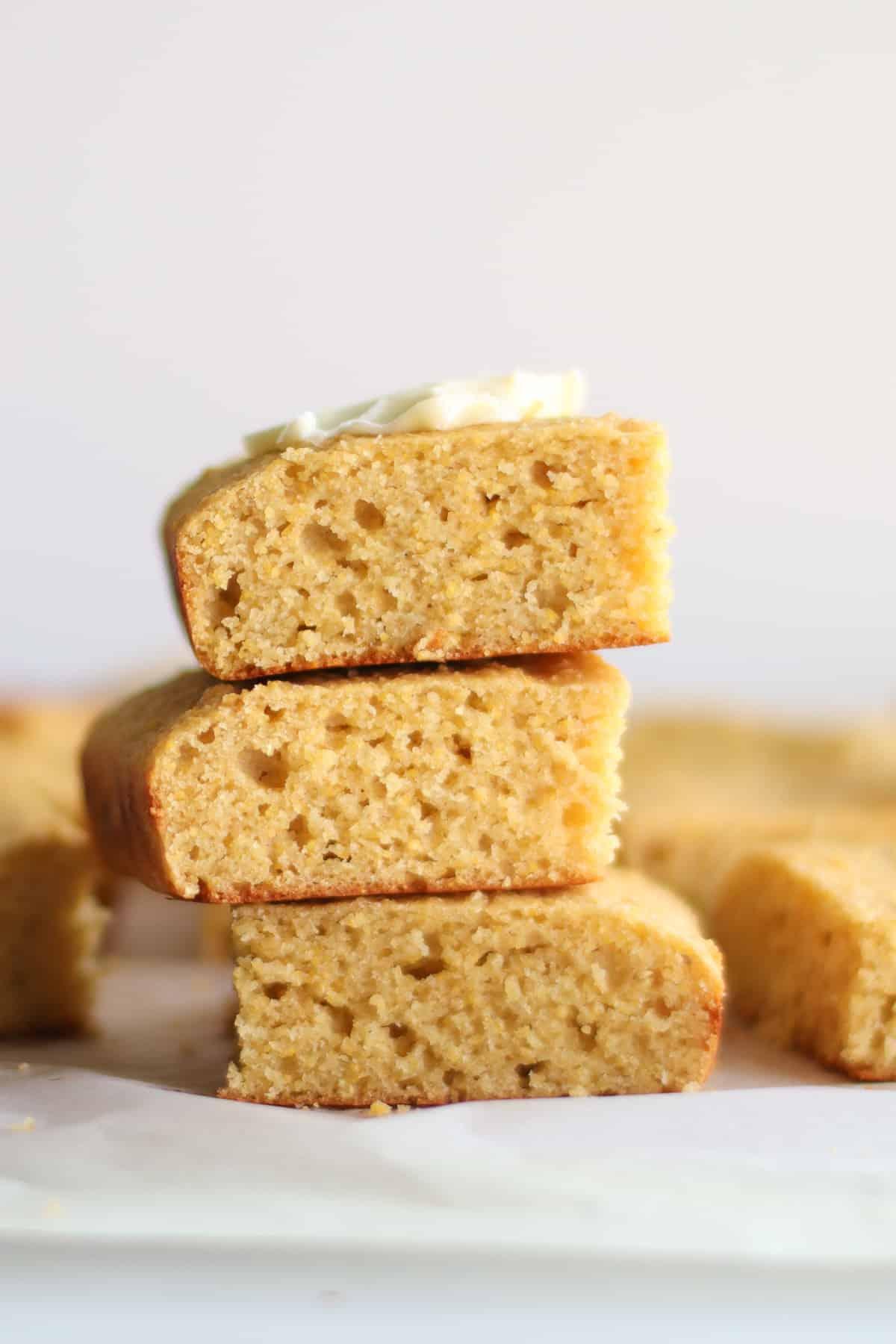 A close-up shot highlighting the texture and color of the cornbread.