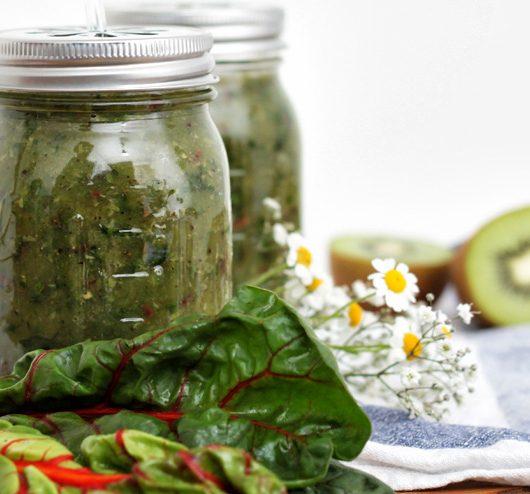 homemade aloe vera kombucha in a glass with aloe vera leaves