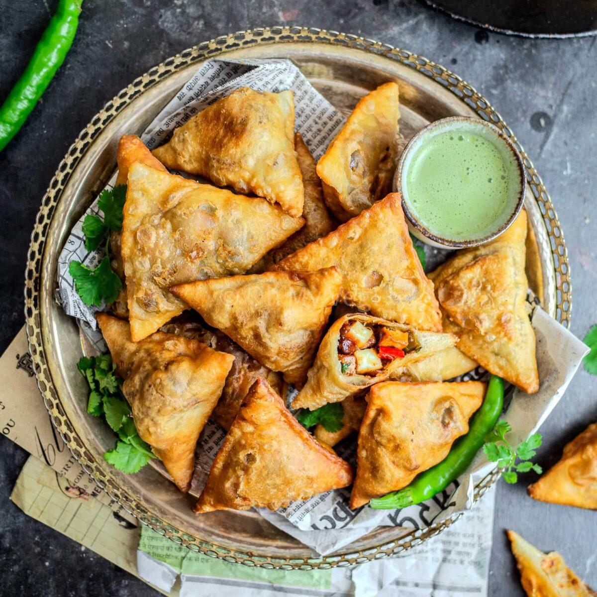 pile of chili cheese fries samosa