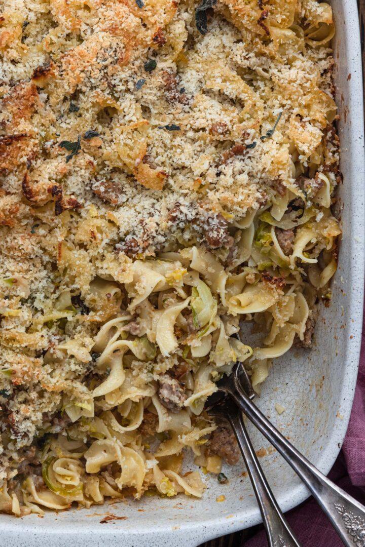 Close up shot of a delicious sausage and brussels sprout casserole, showing the caramelized sprouts and browned sausage