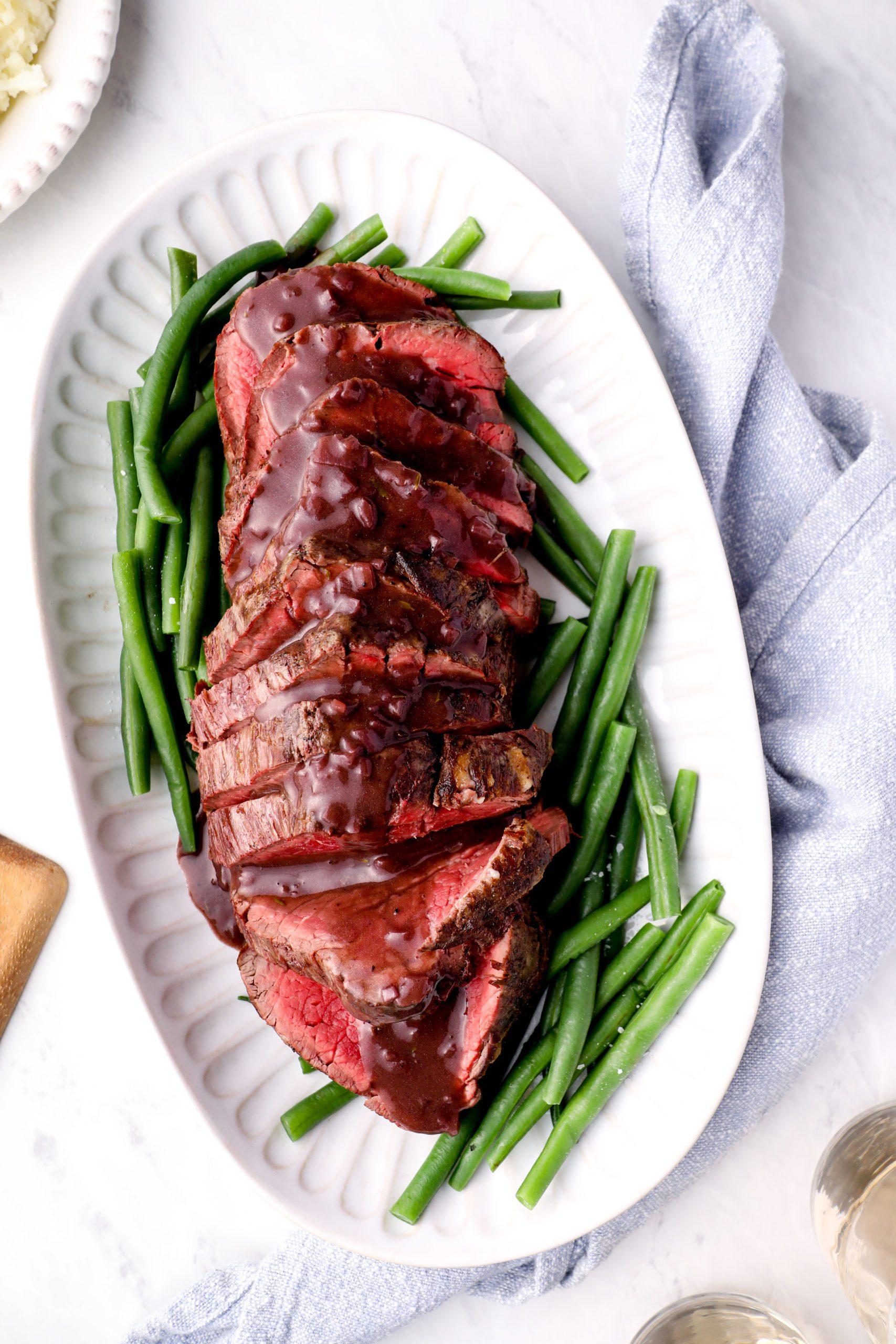 A juicy roasted beef with a rich red wine reduction