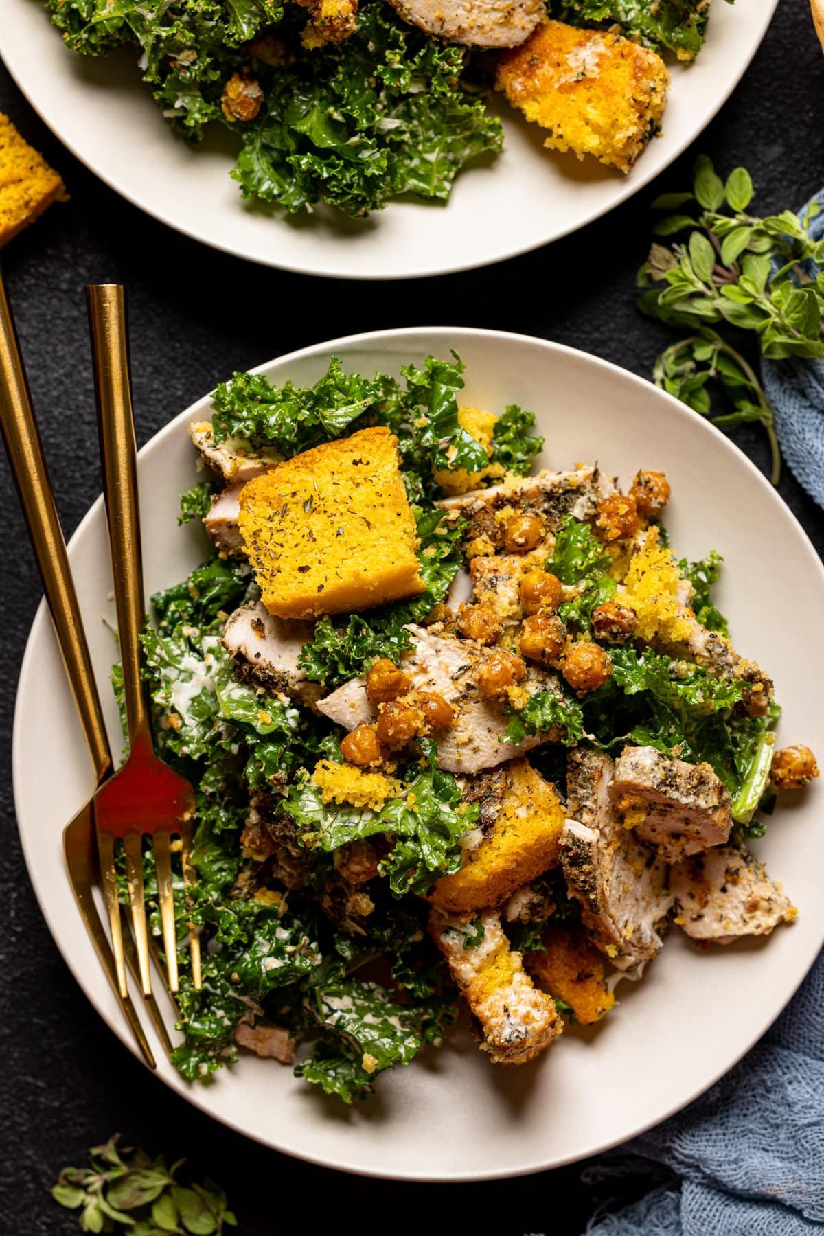 Close up shot of a jerk chicken Caesar salad with crispy croutons