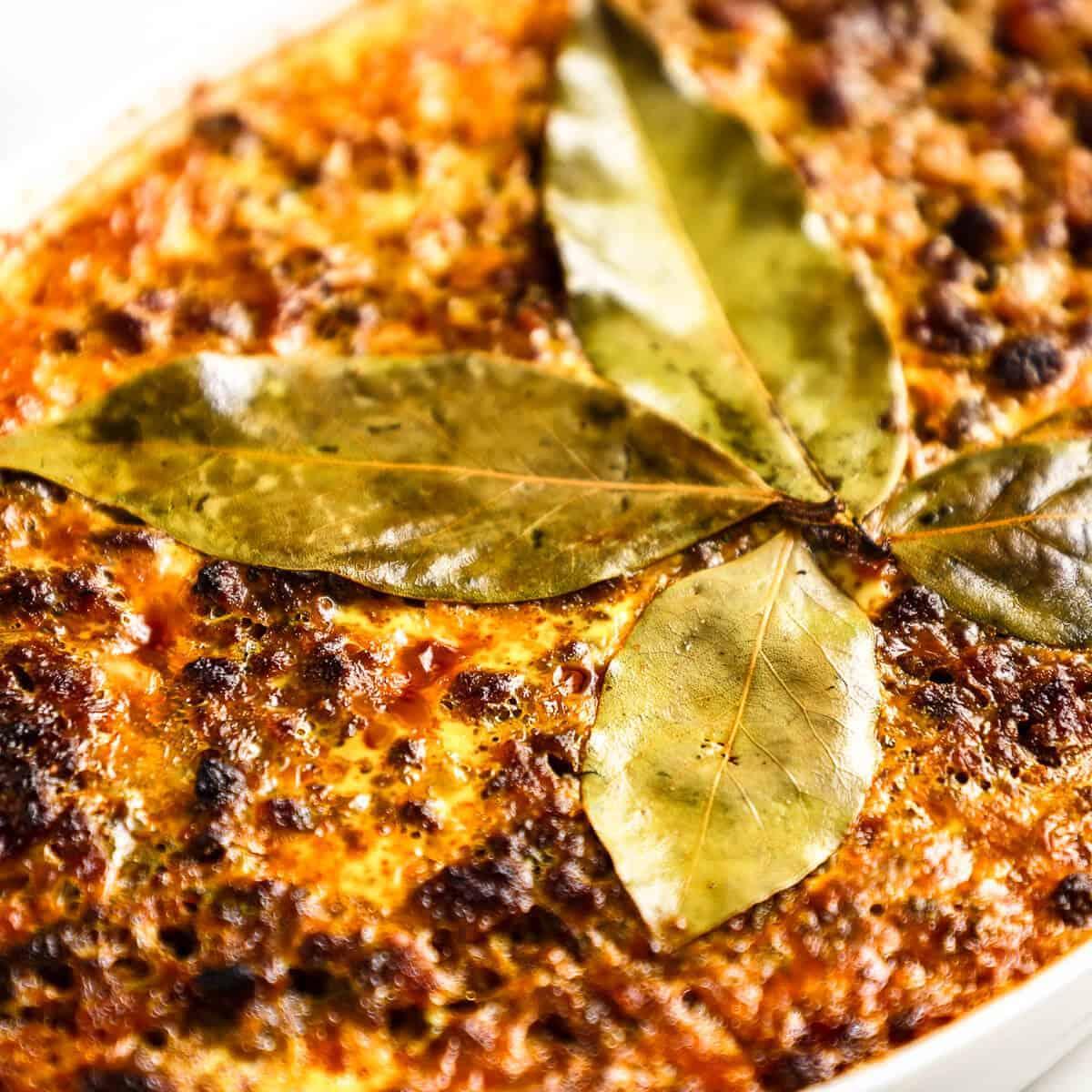 Close-up of a Cape Malay Bobotie with Apricot Gastrique in an ovenproof dish