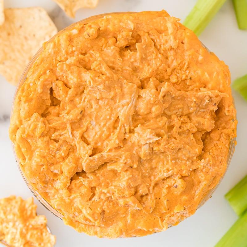 Close-up shot of Buffalo Chicken Dip being mixed in a bowl