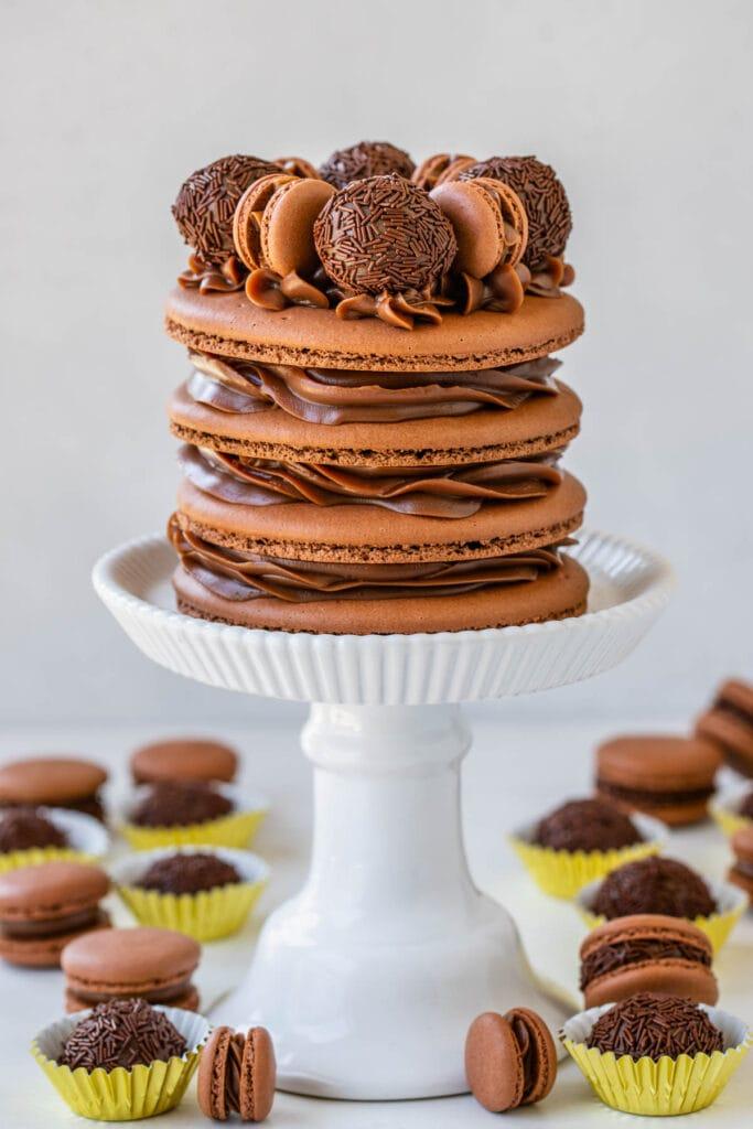 a batch of beautifully decorated birthday brigadeiro cupcakes on a stand