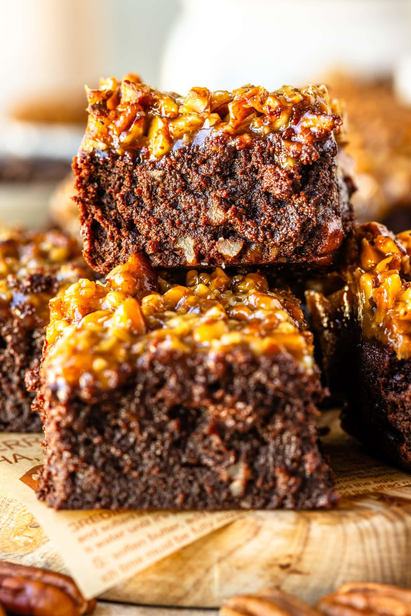 A close-up of a gooey brownie with a crunchy pecan crumble topping