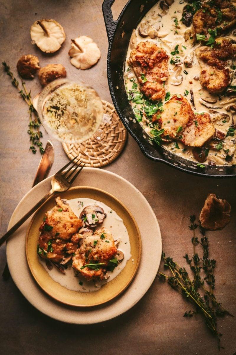 Elegant table setting with champagne-infused chicken and lemon butter sauce