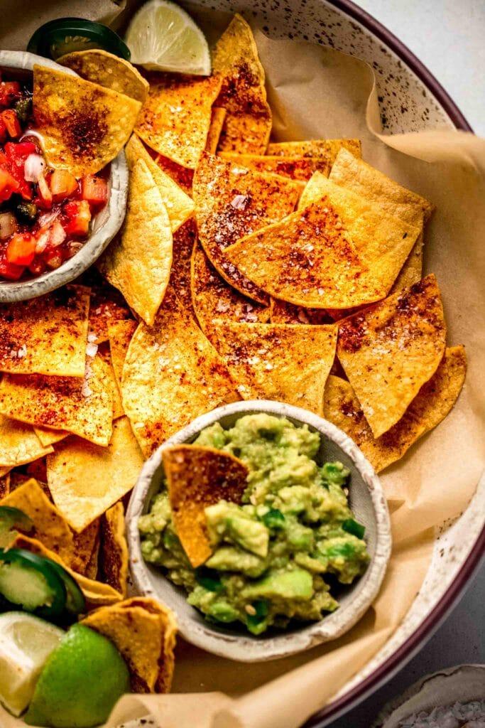 A close up of freshly baked crispy tortilla chips.
