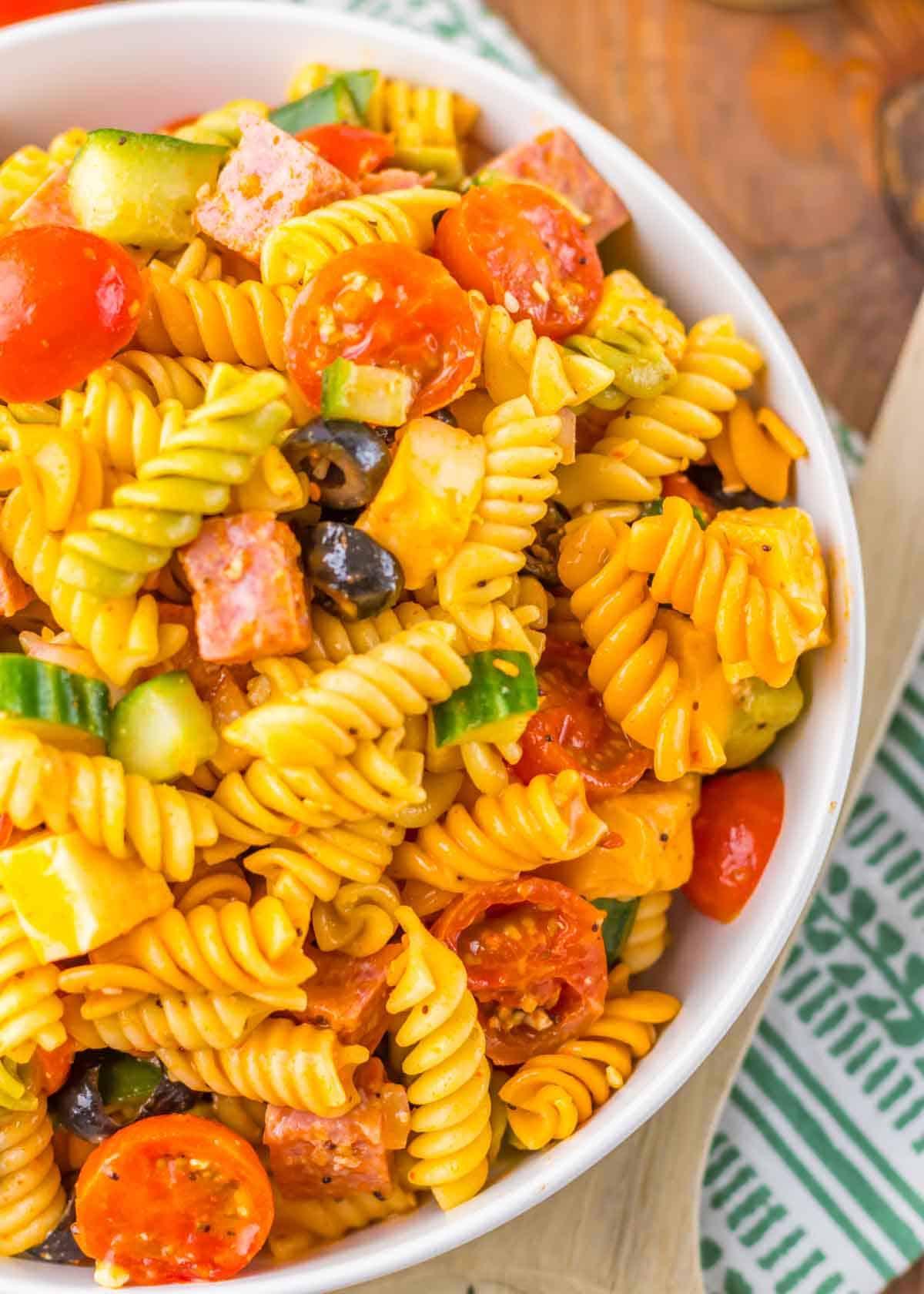 Close up shot of the finished Italian pasta salad, showing the vibrant colors and textures.