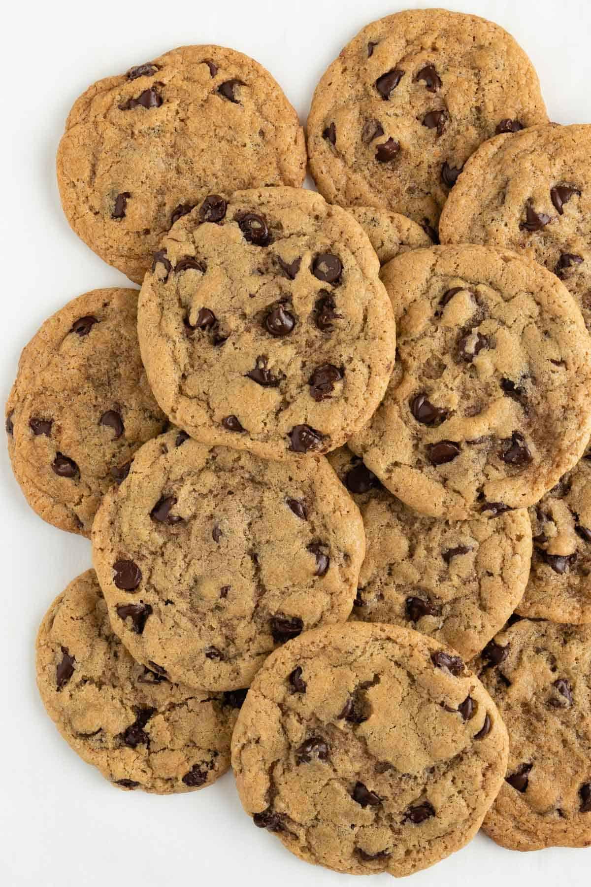 A close-up shot of a pile of dairy-free and egg-free chocolate chip cookies