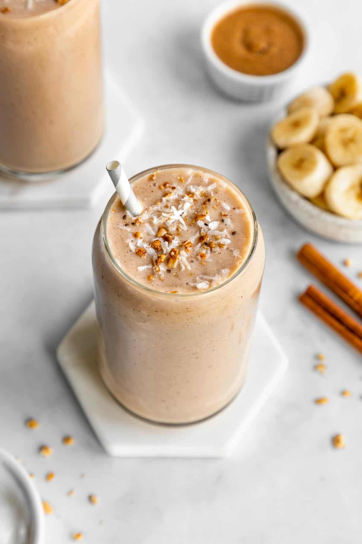 Person enjoying a banana and almond butter smoothie