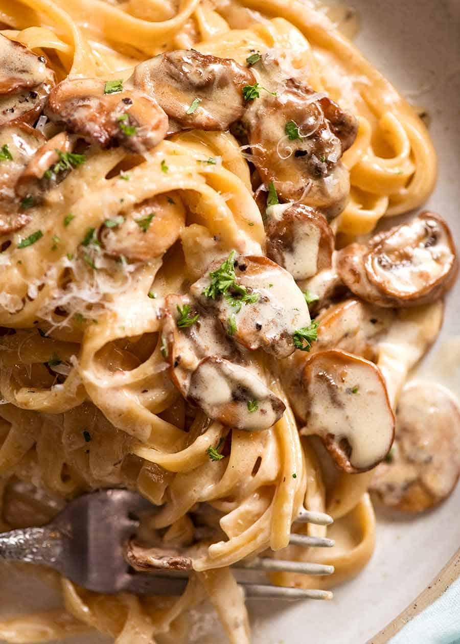 Close up of creamy mushroom sauce on pasta