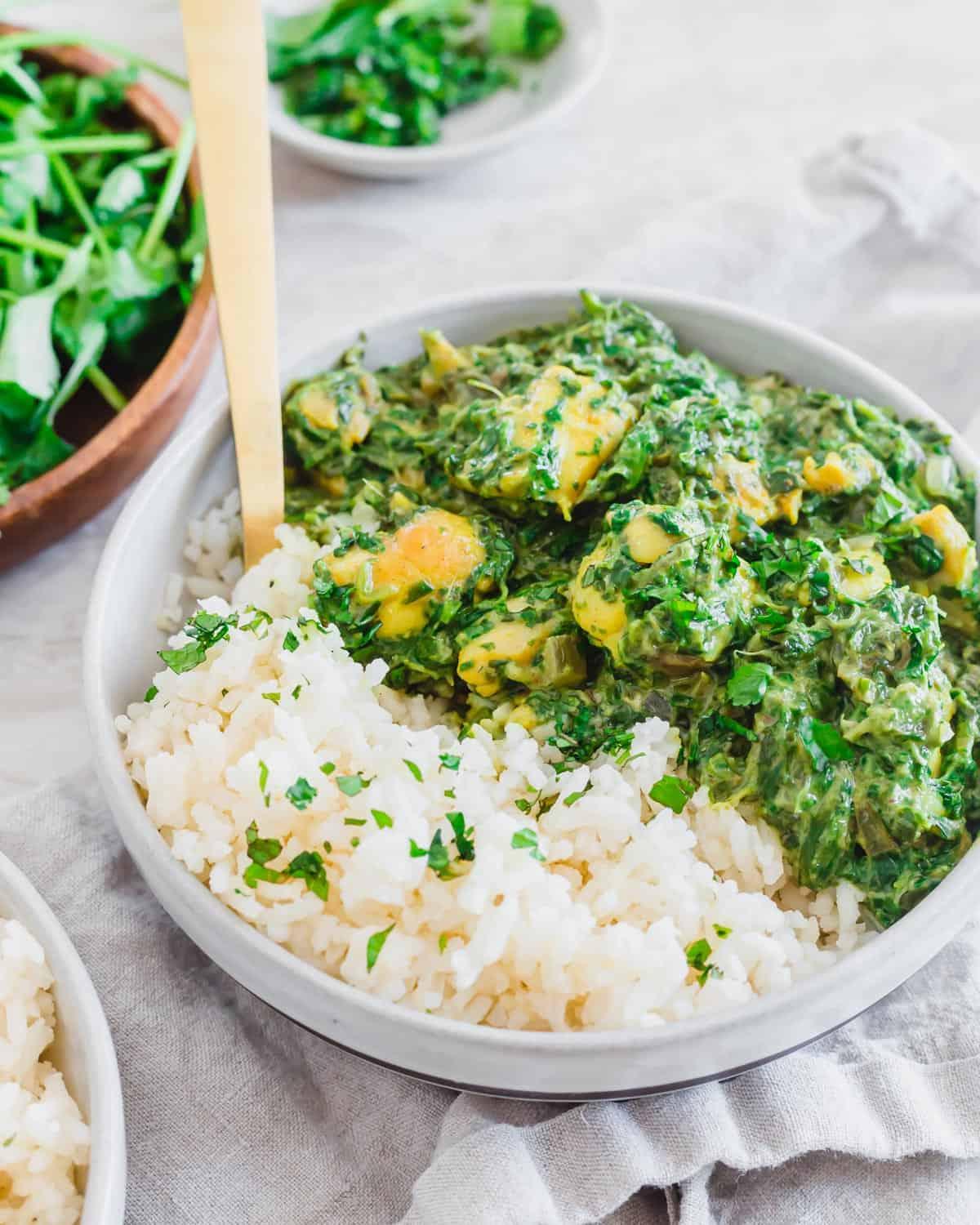 Chicken Saag being served with naan bread and basmati rice