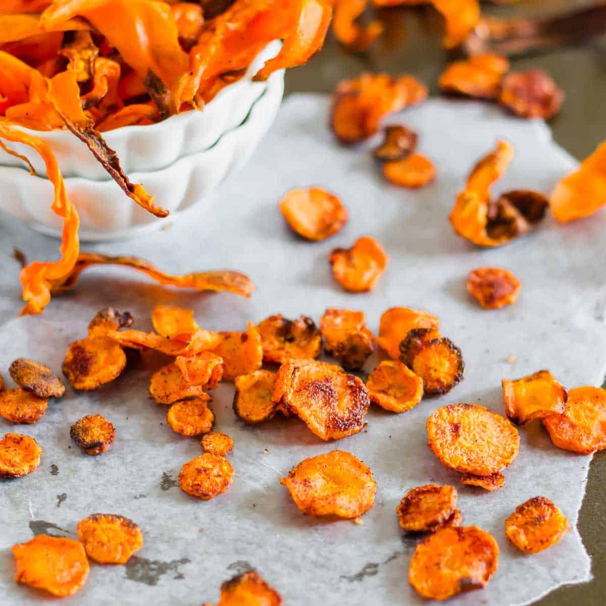 crispy cumin spiced carrot top chips on a baking sheet