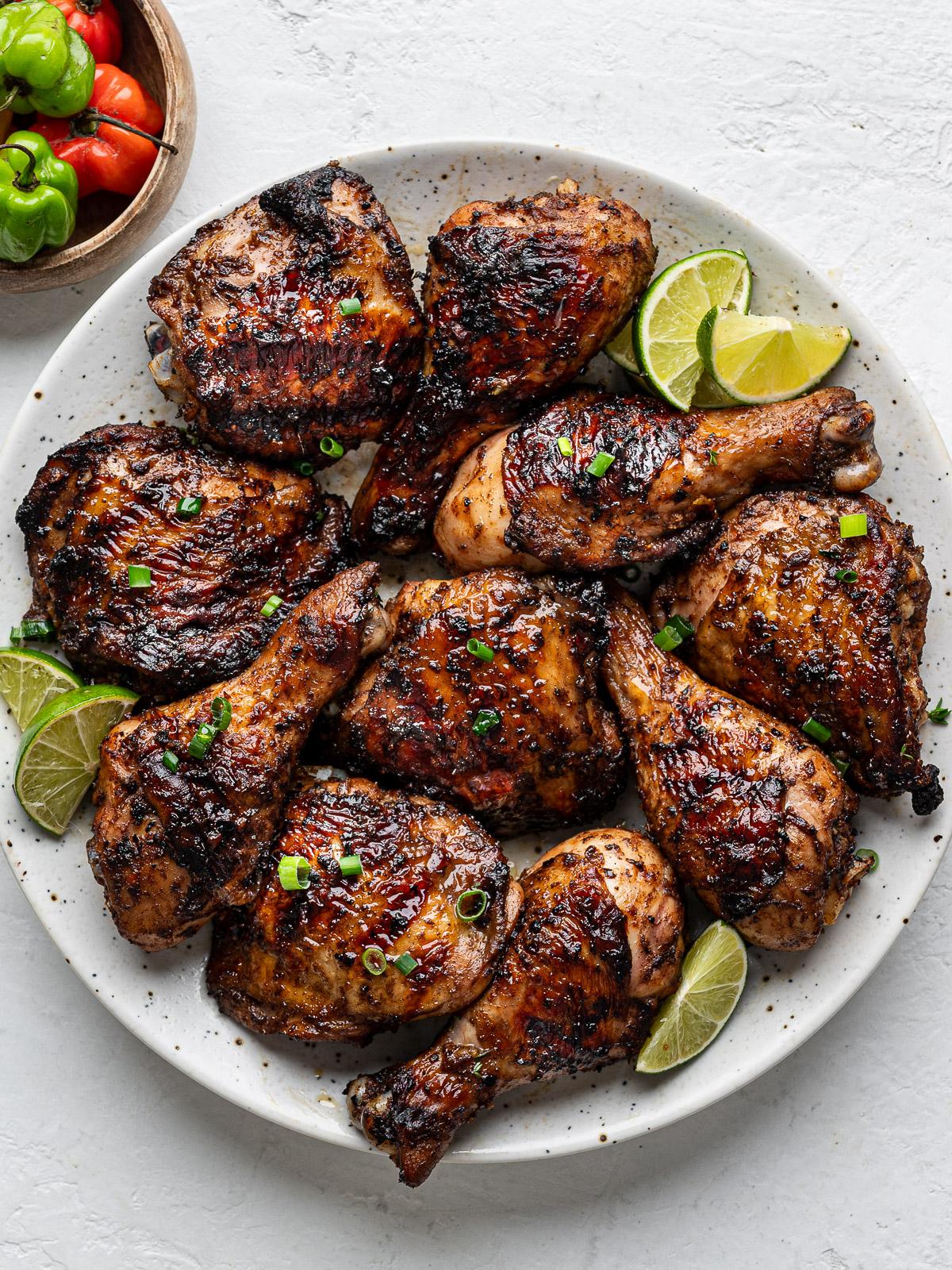 A family enjoying Island Jerk Chicken together outdoors.