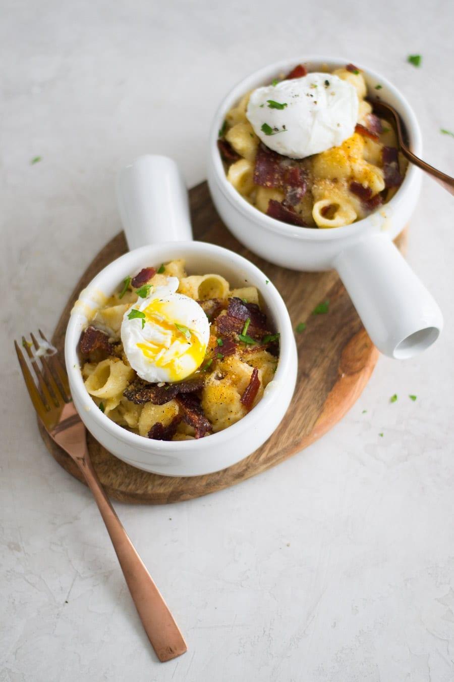 Mac & Cheese with Fried Egg and Bacon served in a rustic bowl