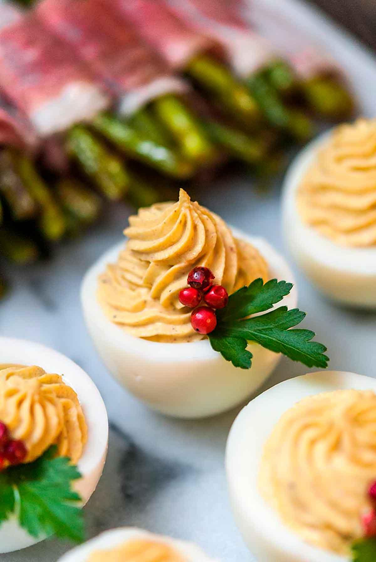 Close-up shot of Christmas deviled eggs garnished with festive sprinkles