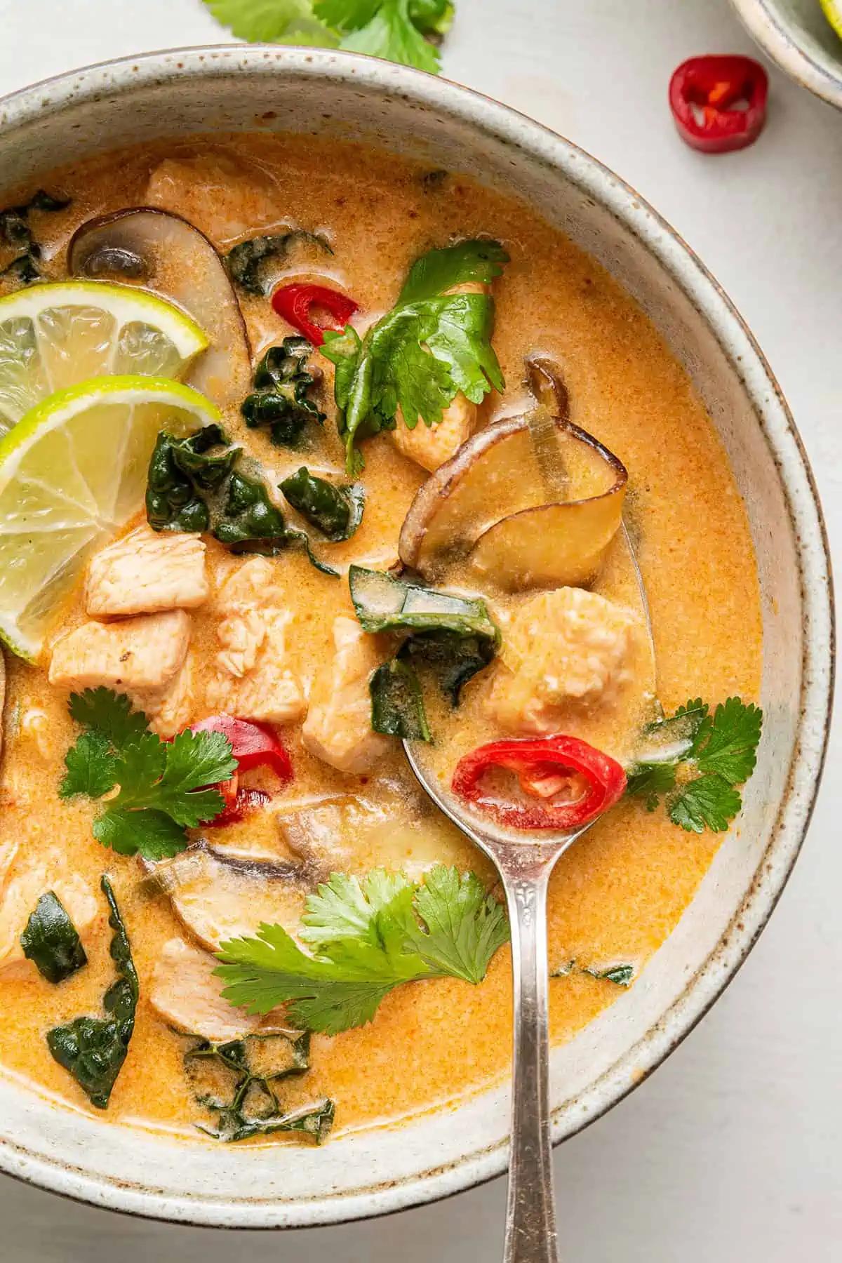 close-up of the fried chicken pieces in the coconut curry broth