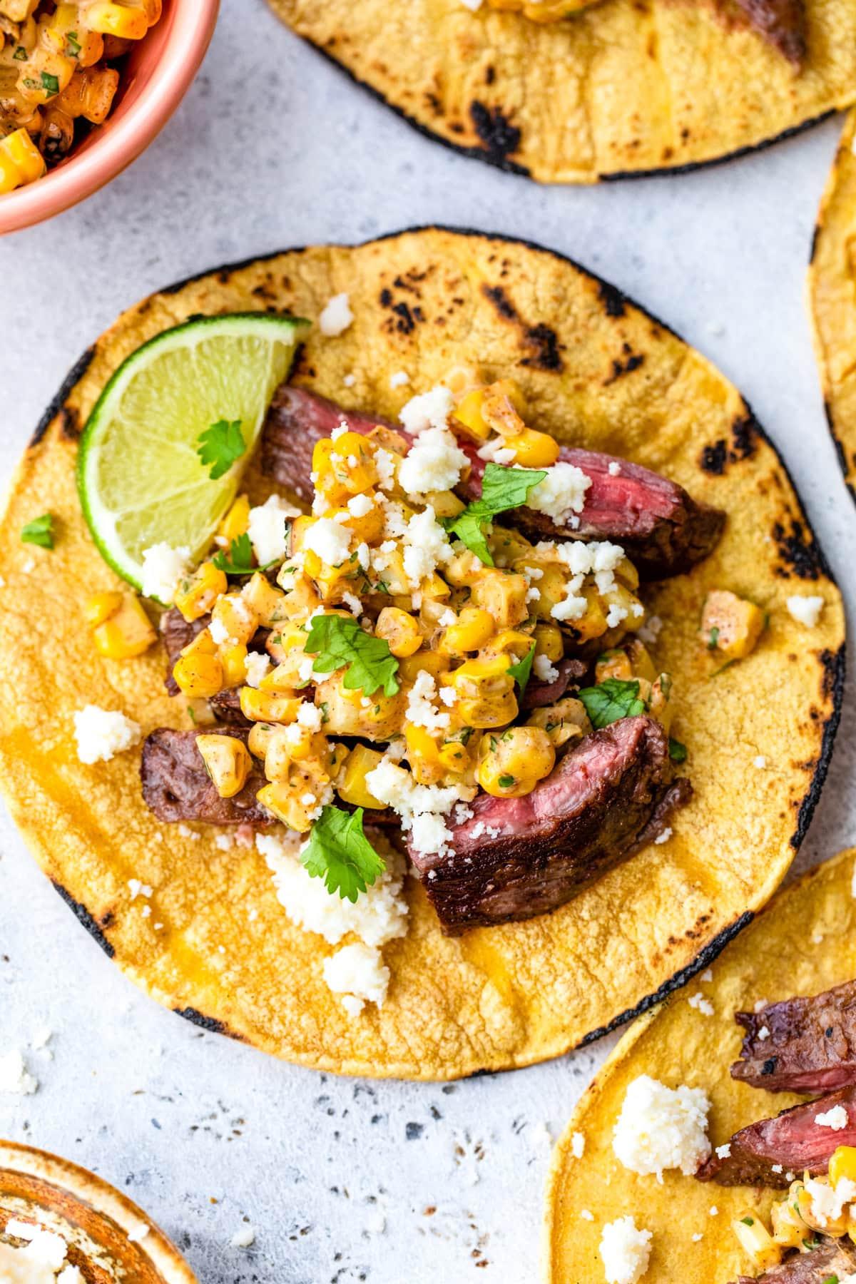 A family enjoying a meal of grilled skirt steak tacos