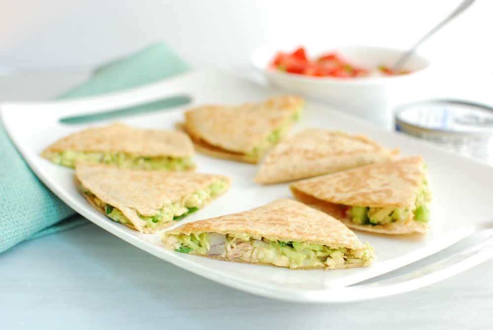 A close-up shot of tuna quesadillas being made in a skillet