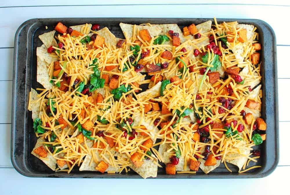 baking sheet with summer squash nachos coming out of the oven
