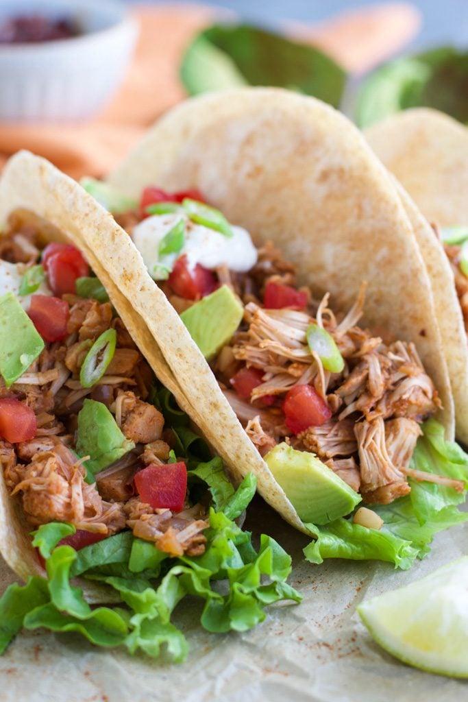 close up of sun-dried tomato jackfruit taco being assembled