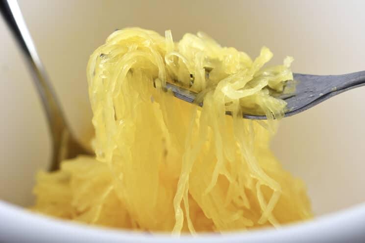 Close up shot of spaghetti squash being shredded